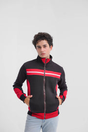 Person wearing a black and red jacket with white stripes on a light gray background