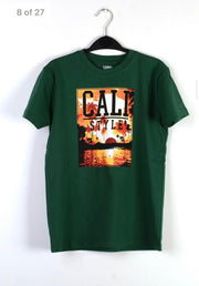 Green t-shirt with 'Cali Style' graphic on a hanger against a white background