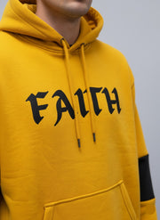 A Man Wearing mustard hoodie close view loopspk